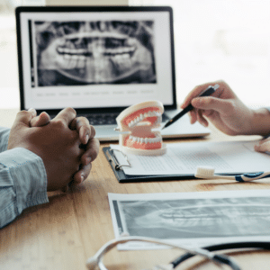 A dentist and a patient discuss preparations for oral surgery.