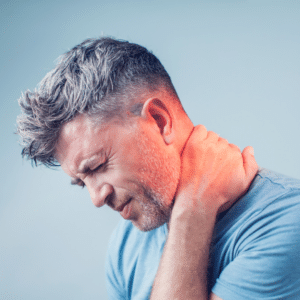 A man is experiencing neck and upper back pain.
