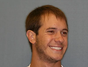 Man smiling after receiving dental veneers